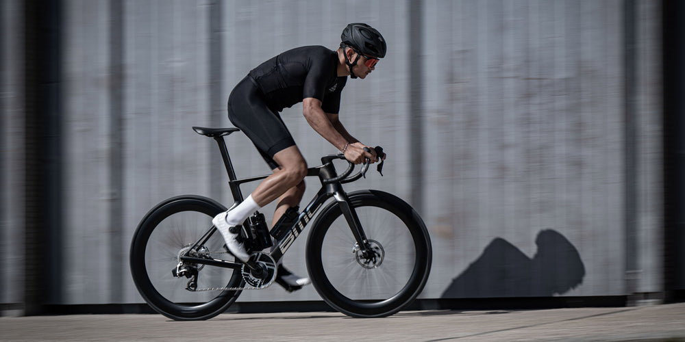 Out of the saddle, bike rider creates speed on the Teammachine R Mpc performance bike from BMC